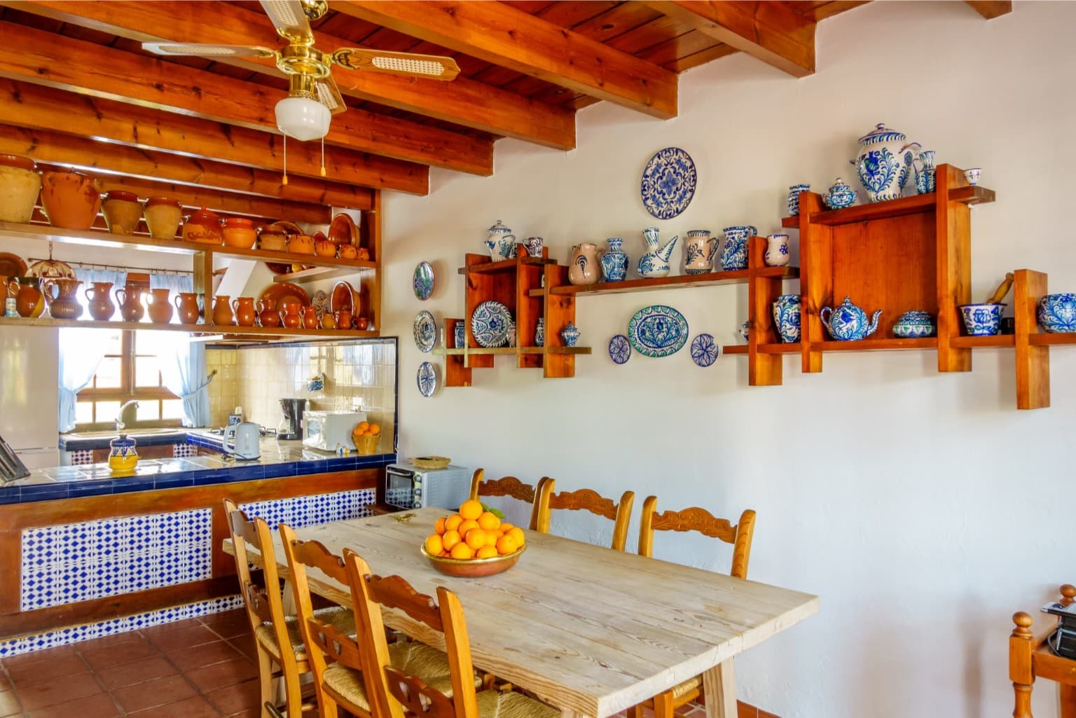 Traditional kitchen dining area with blue and white ceramics.