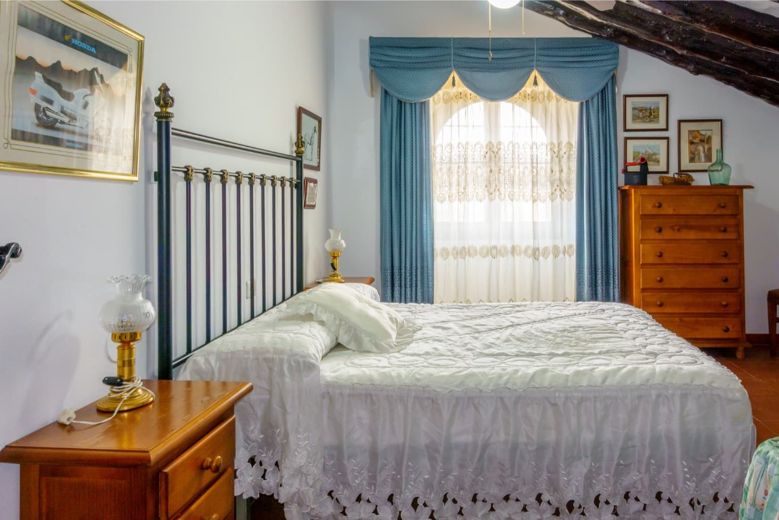 Cozy guest room with traditional wooden wardrobe.
