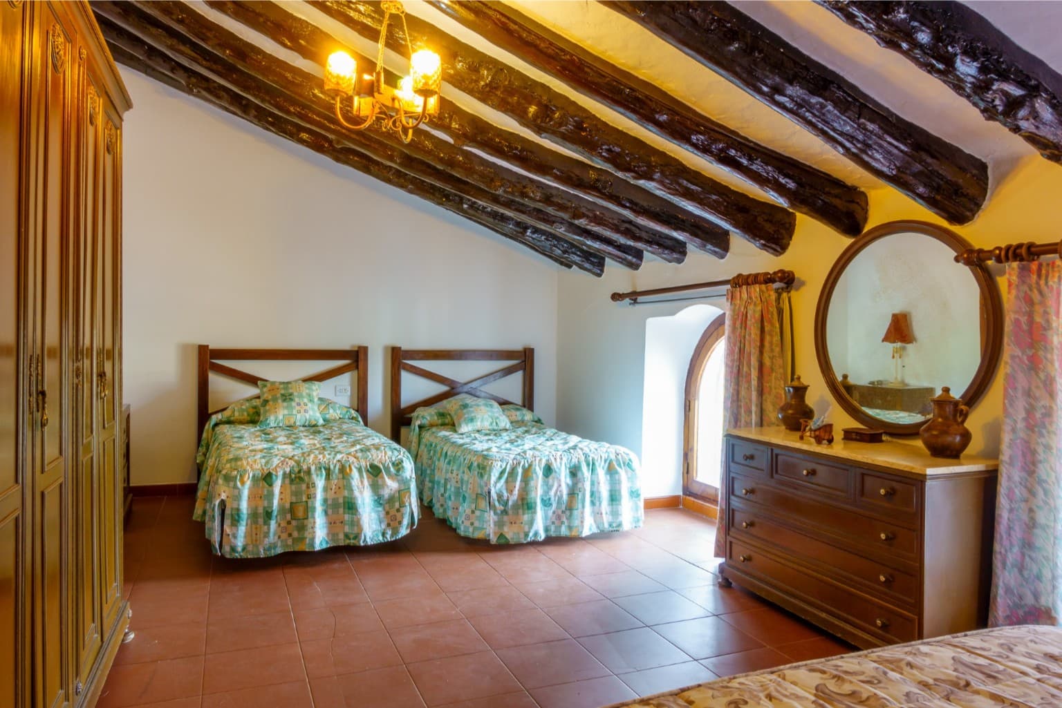 Bright twin room nestled under the charming wooden roof.
